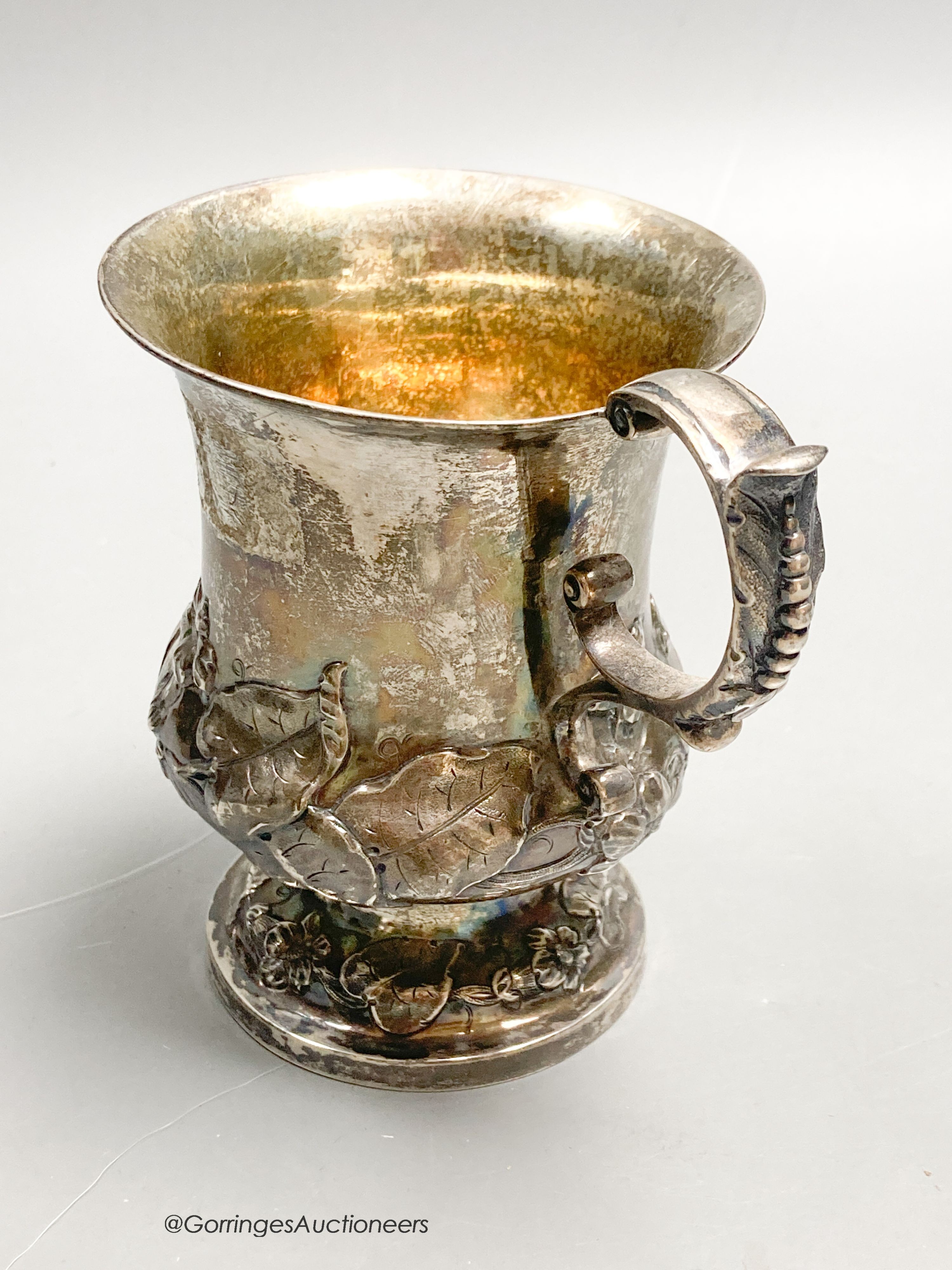 An early Victorian silver vase shaped christening mug, embossed with leaves, Brown & Somersall, London, 1839, 10.8cm, 5oz.